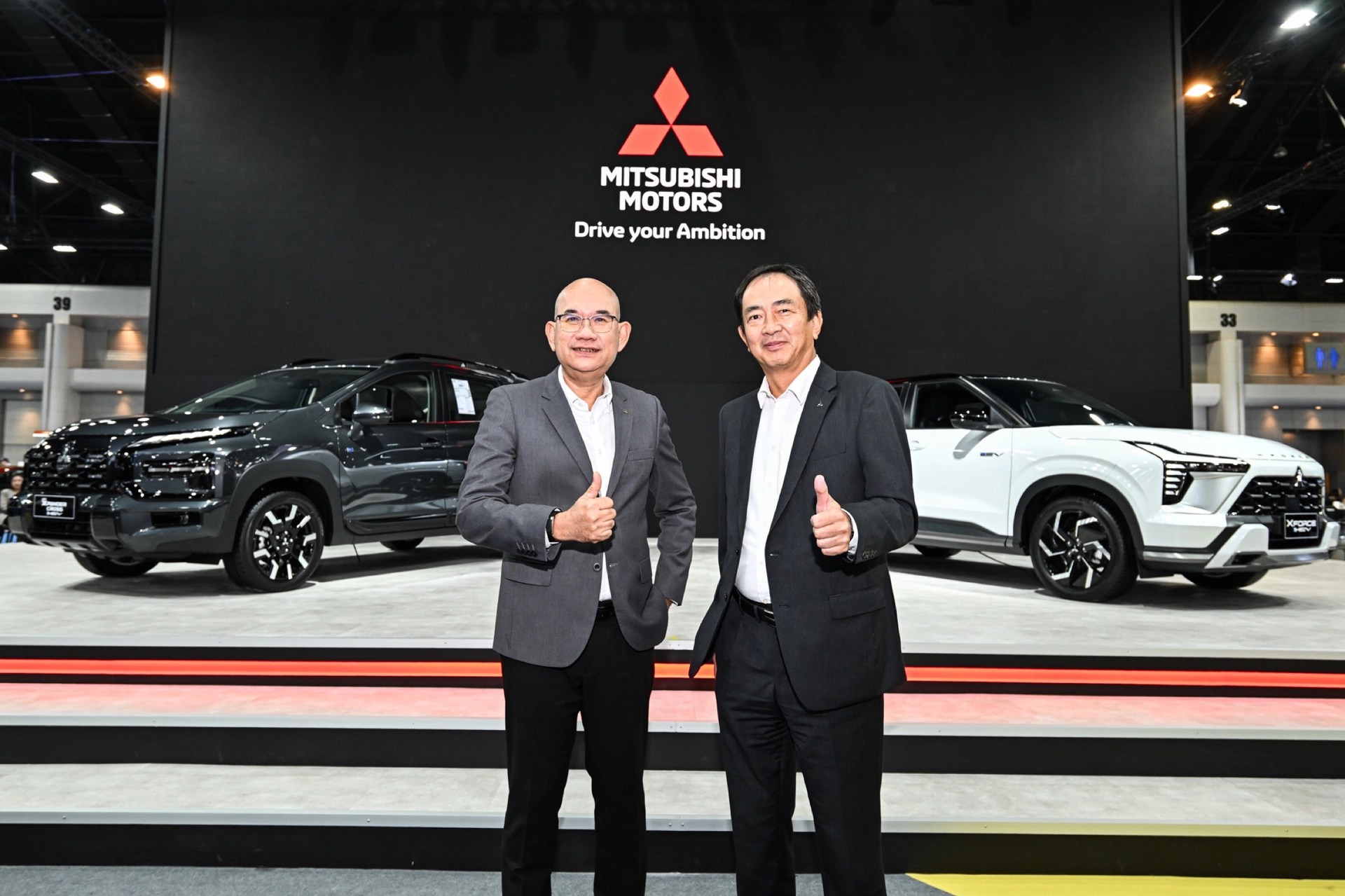 Automotive brand executives at a motor show